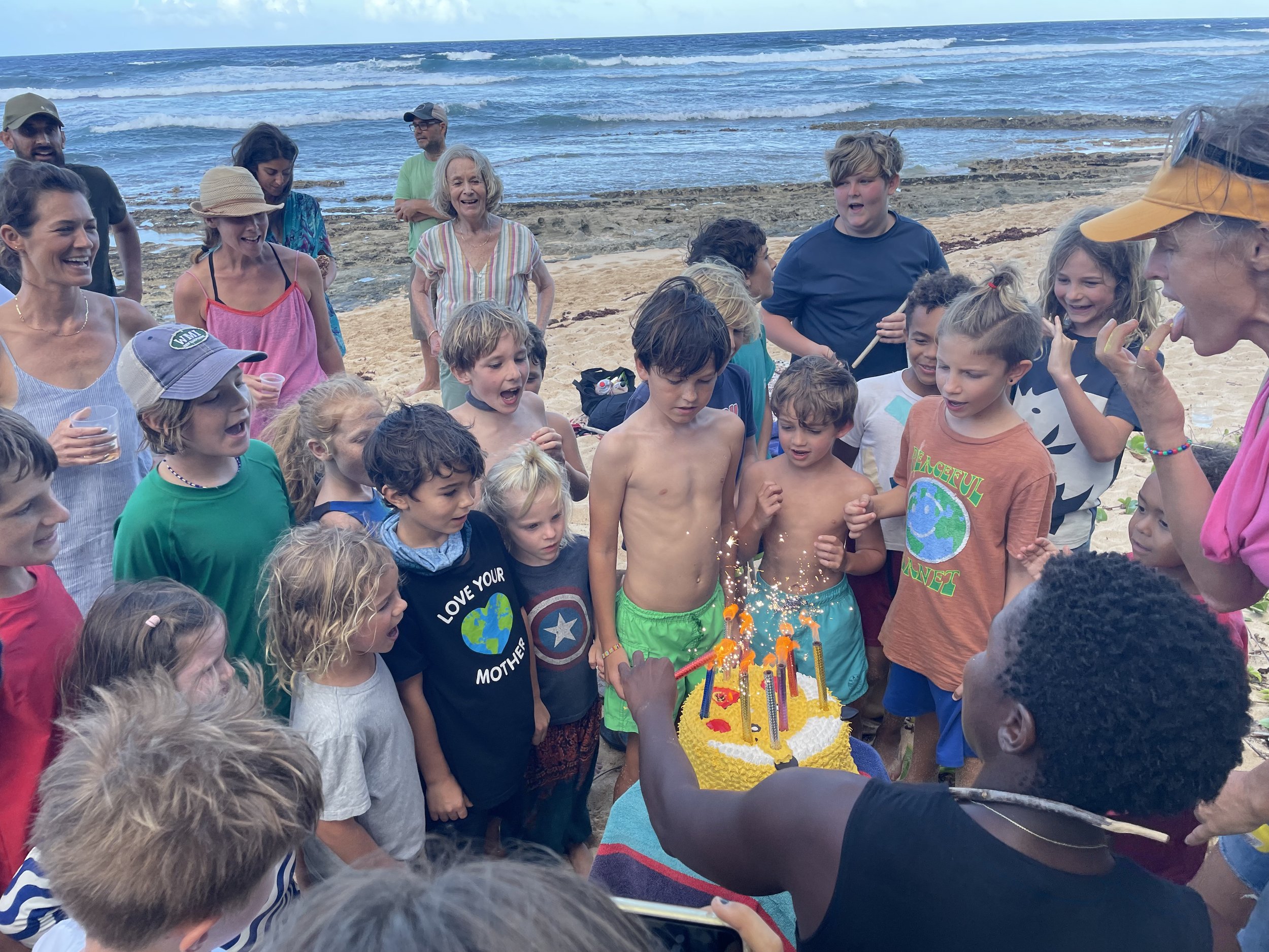 Trekker with cake and onlookers