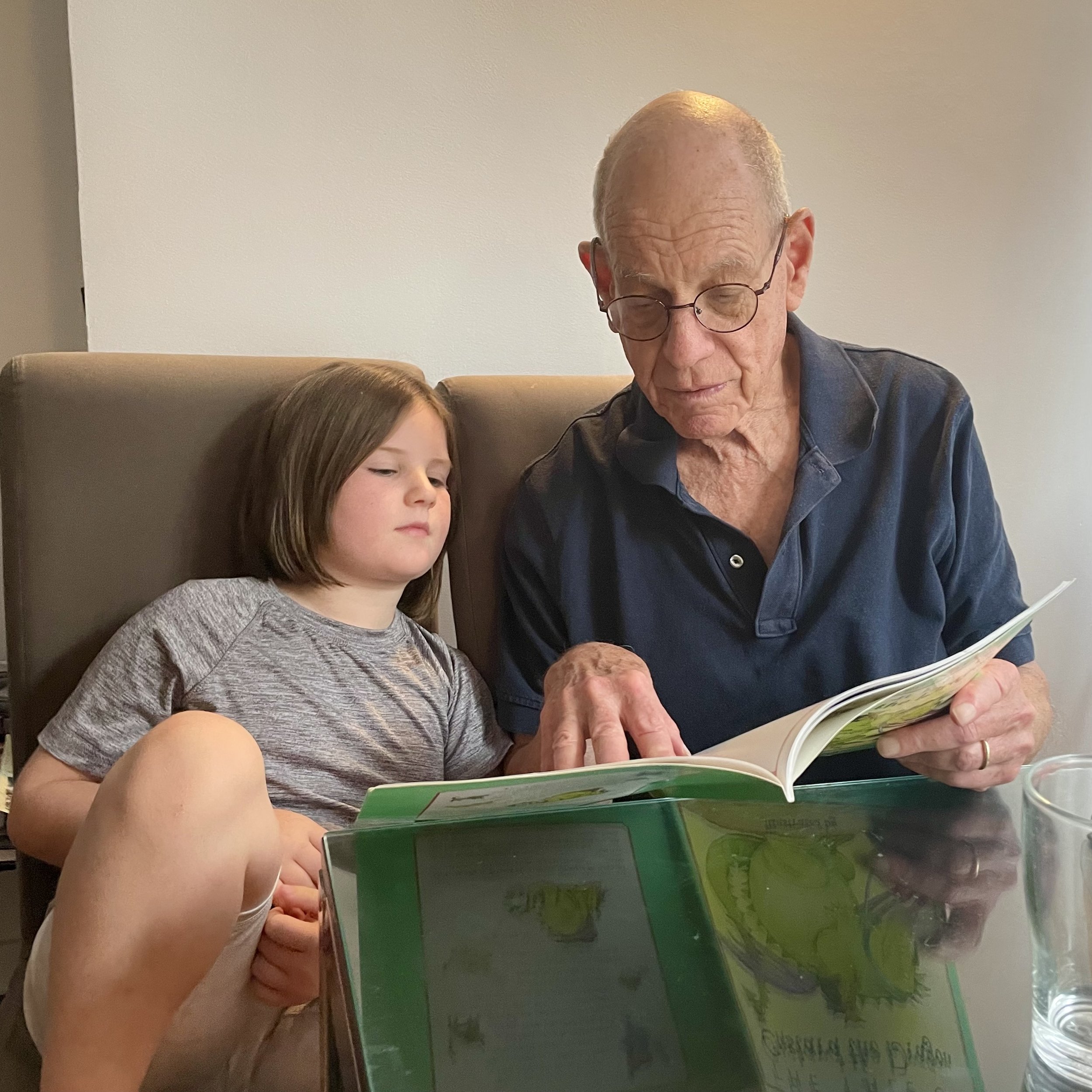 Poppa Bob reading some books he brought