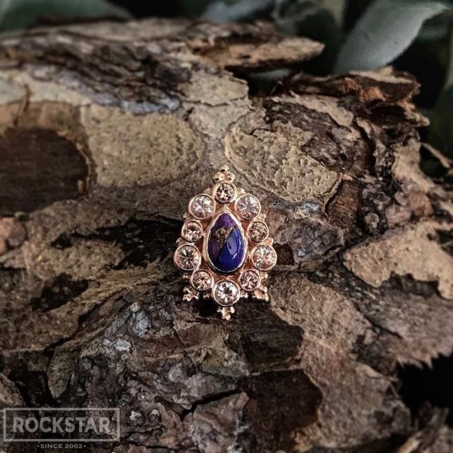 Hello, Lucy! &bull; This beauty features Purple Copper Turquoise surrounded with Oregon Sunstone &amp; Champagne Sapphires #bvla
:
:
:
:
:
:
:
:
📷 @rebecca_decurtis #rockstarpiercing #rockstarbodypiercing #piercing #piercings #providence #providence