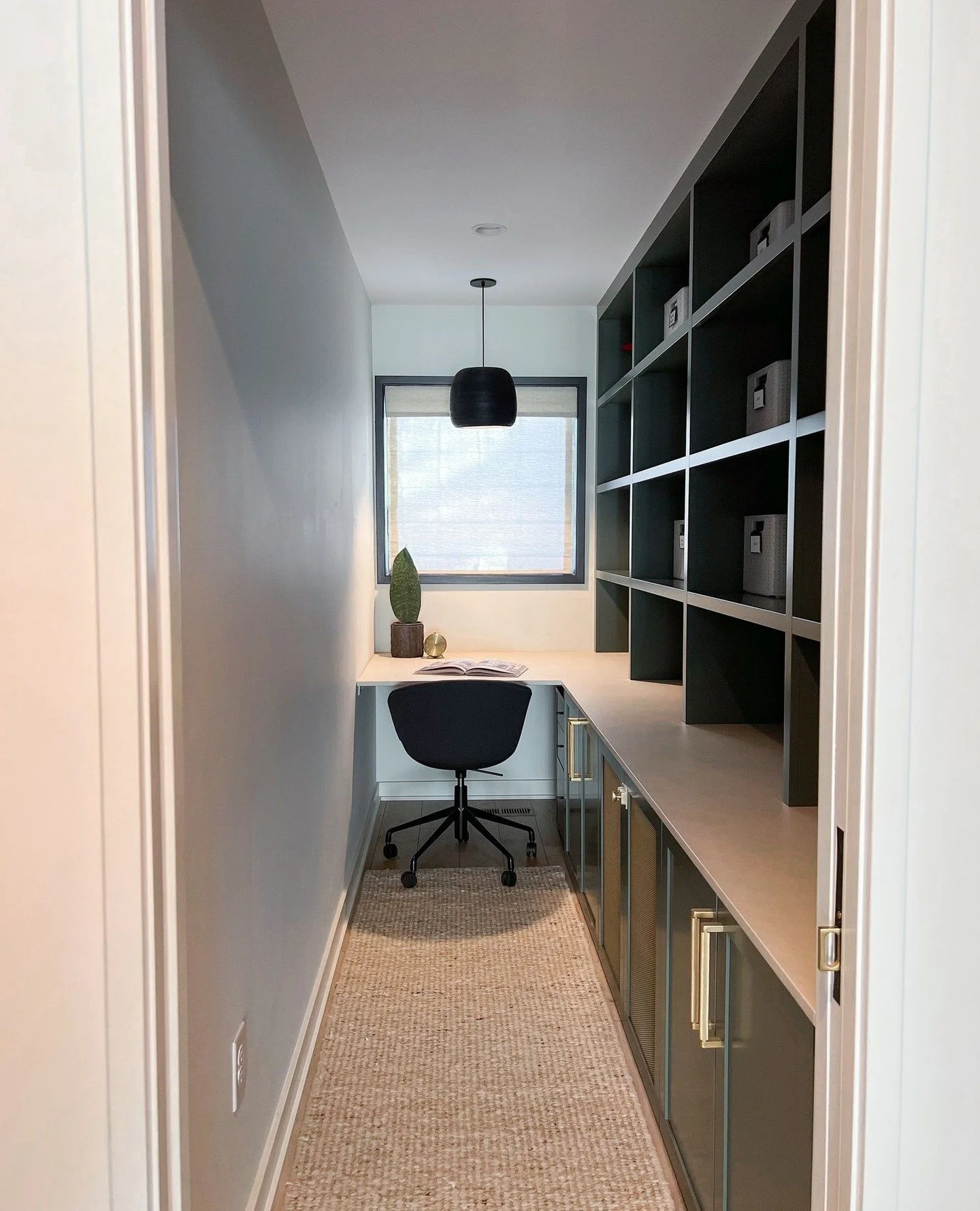 Small footprint, big function! This multi-use space packs a punch with custom storage solutions designed to keep life organized...and boy does this client like to keep things tidy!  From a tucked-away desk to concealed mudroom storage and plenty of r