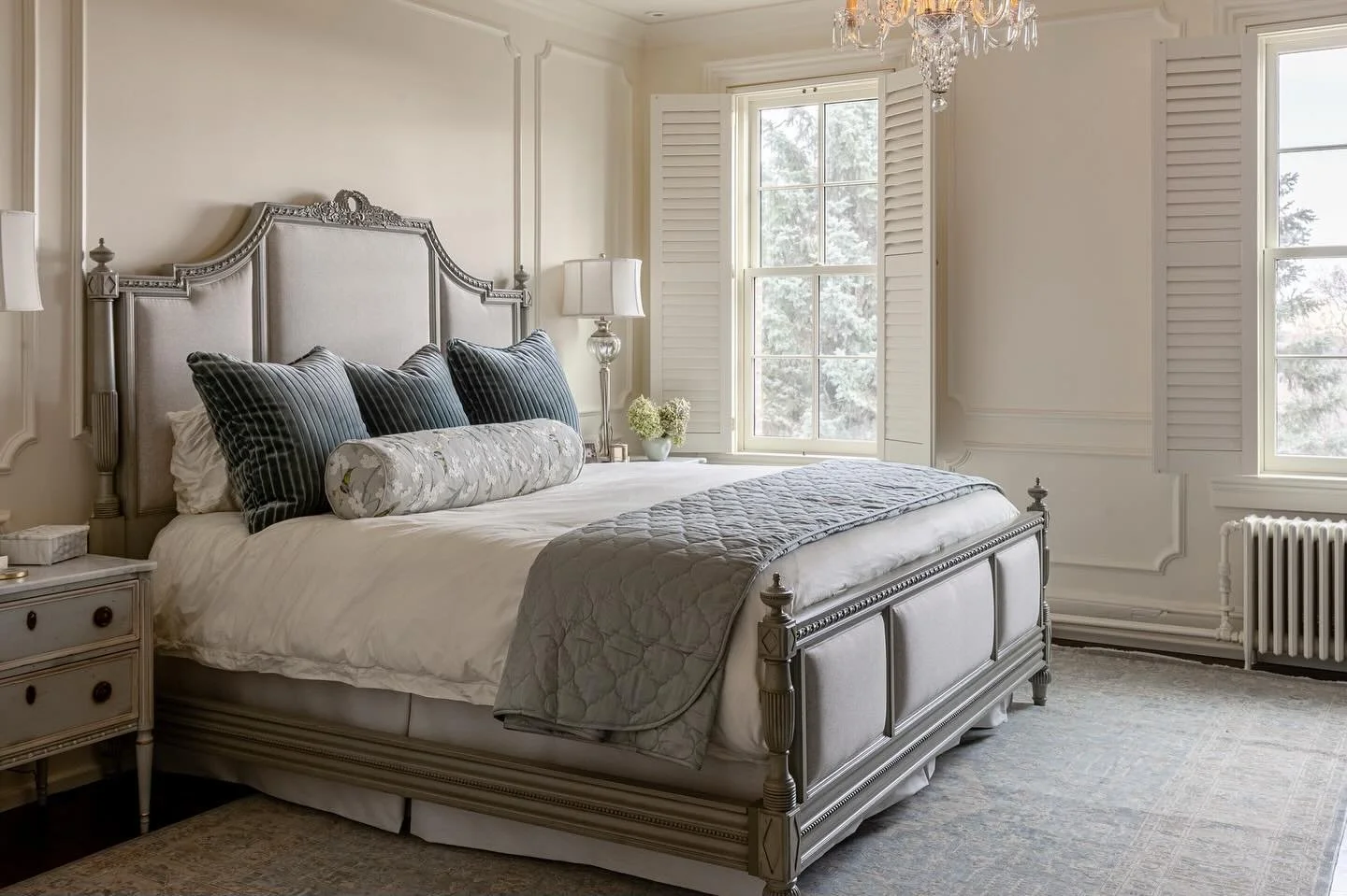 Serene and fit for a queen. This primary bedroom blends custom built-ins, creamy warm walls, and the home&rsquo;s original chandelier for a touch of timeless elegance.

And tucked behind a secret door? Every woman&rsquo;s dream closet. 👀
Come back t
