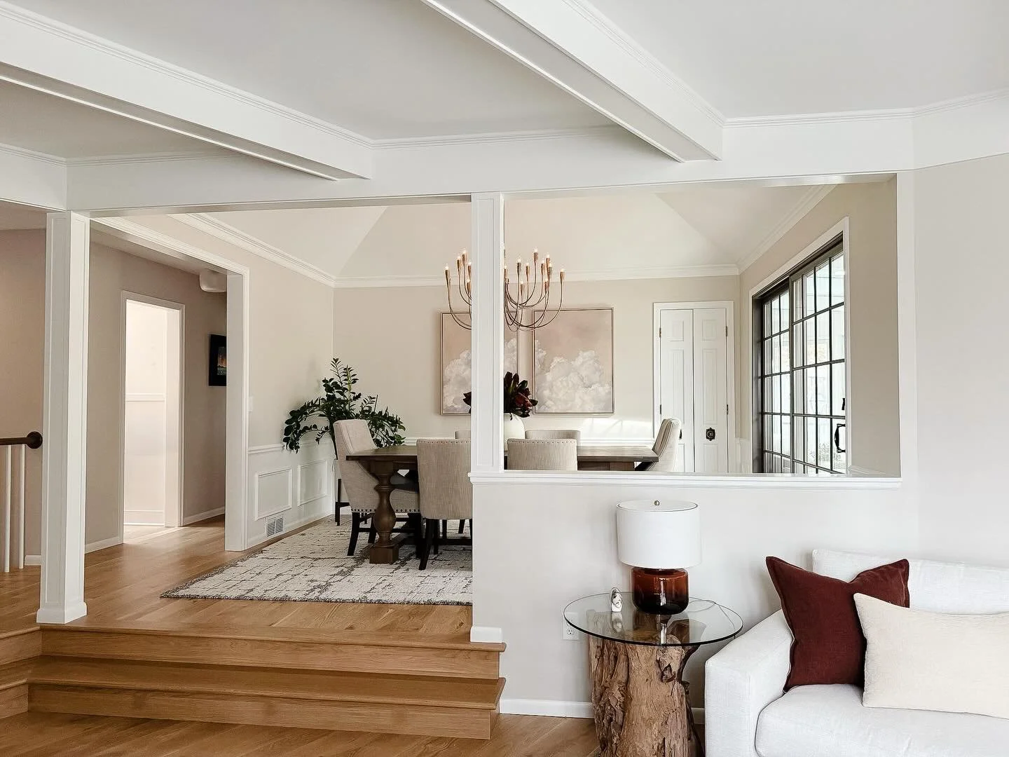 We removed a portion of the half wall, said goodbye to the outdated decorative posts, and carried the new hardwood through to connect the main floor. The result&mdash;brighter, more open, and so much more inviting.

➡️for before pics 

Design: @studi