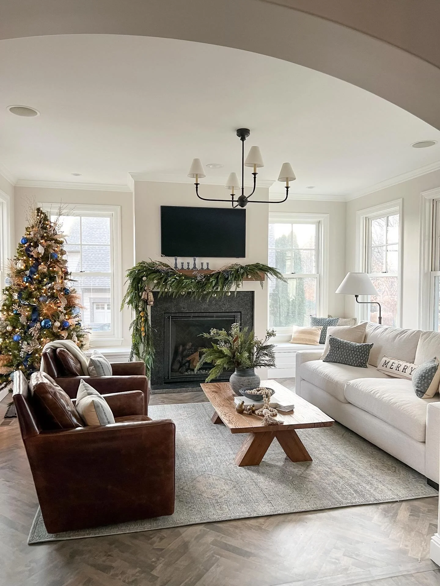 One of my favorite parts of a remodel is getting to see it styled for real life &mdash; especially the holidays.
The fresh textures and refined palette made the perfect canvas for this greenery with blue + metallic notes. Simple, layered, and festive