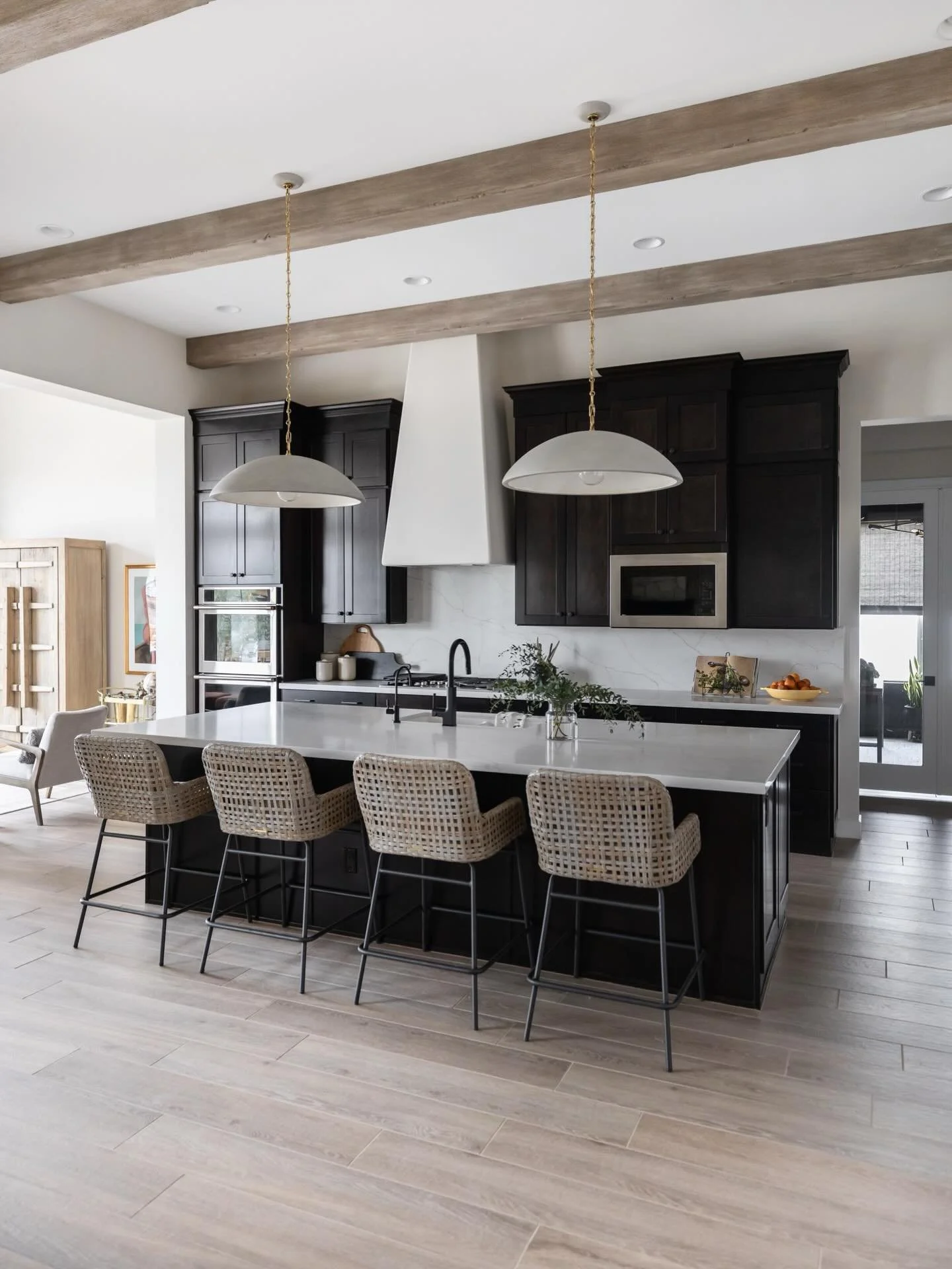 A few thoughtful upgrades go a long way. Beams, new lighting, and a textured vent hood completely changed the feel of this kitchen&mdash;warm, elevated, and inviting.

📸: @lifecreated
