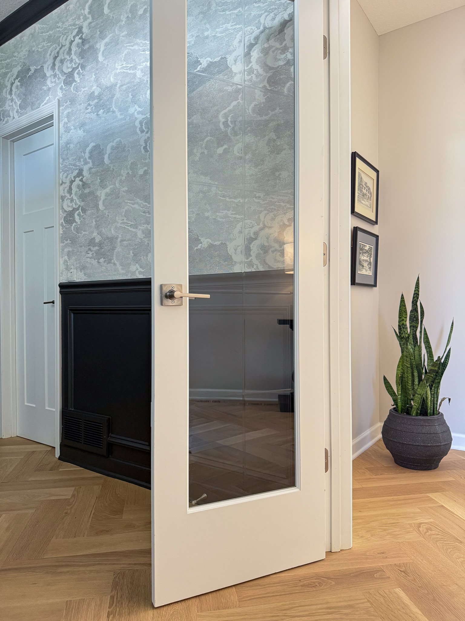Cohesion was a big part of this main level transformation&mdash;elevating the builder-grade finishes and adding the personality the homeowners were looking for.

Millwork carried from space to space, layered with wallpaper, new lighting and, of cours
