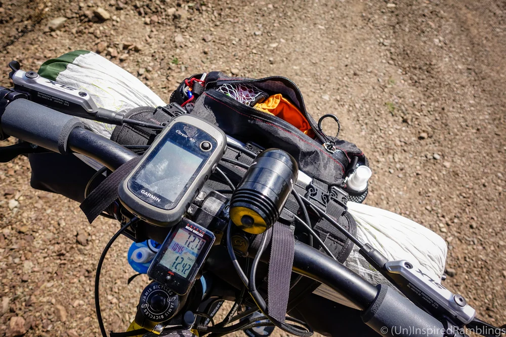 Revelate Designs Pocket attached to their Harness, carrying a drybag and tent on my Jamis Dragonslayer