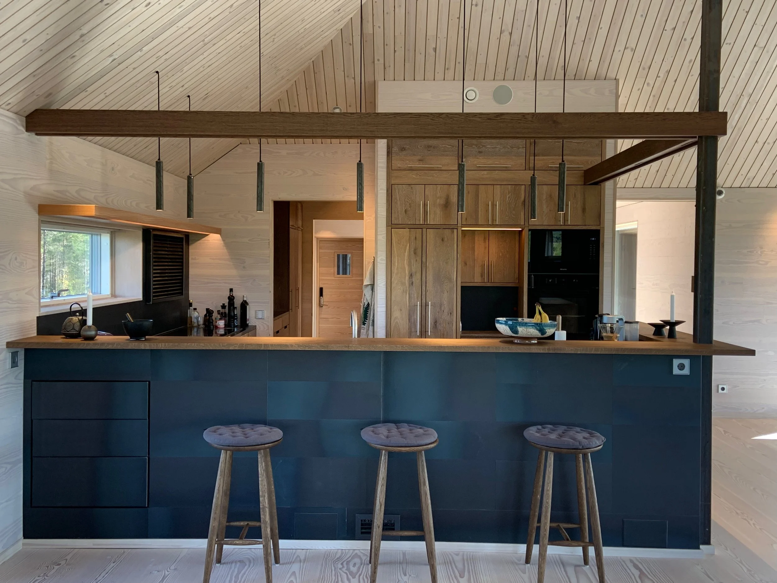 Kitchen with wall-recessed fan