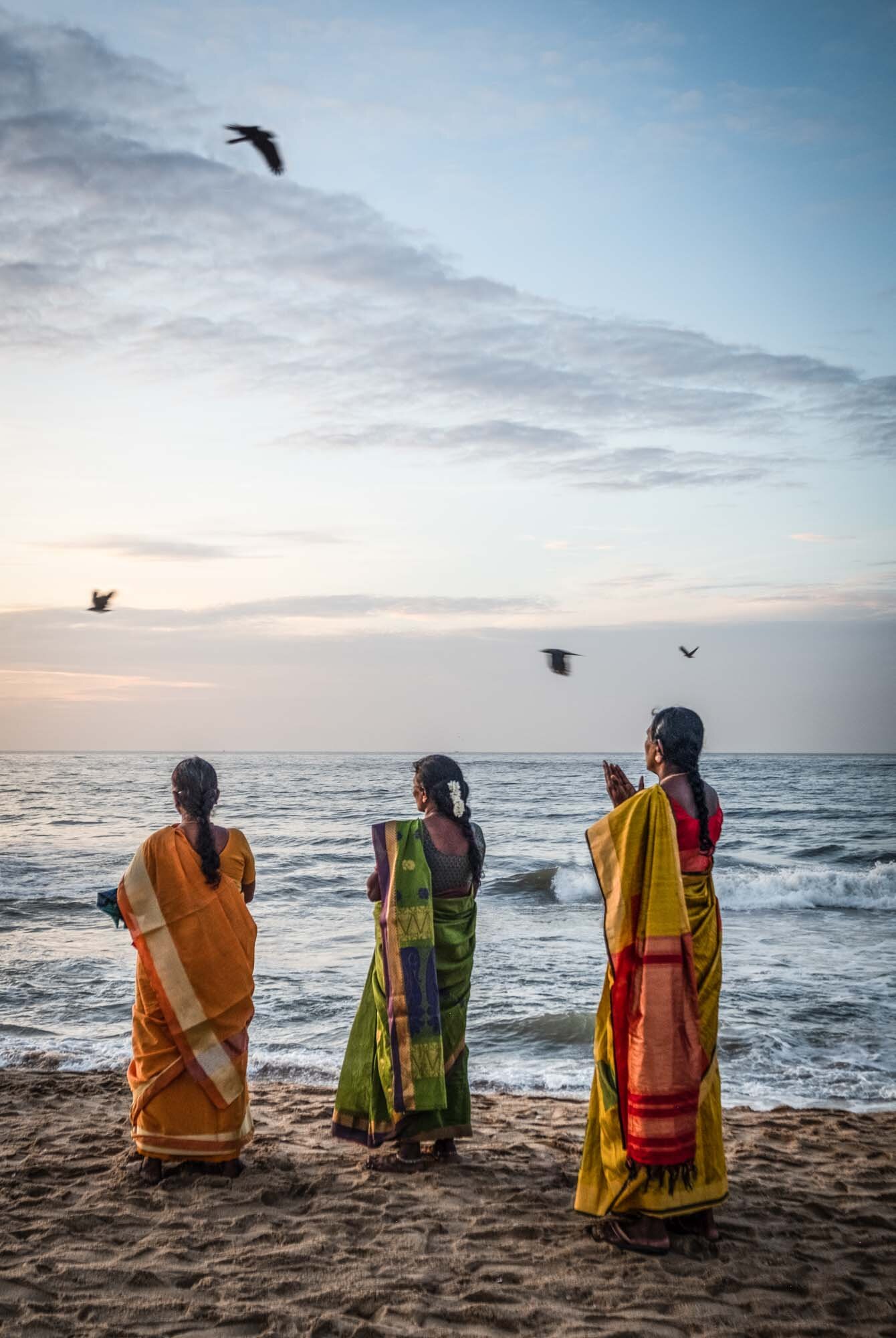  Worshippers greet the sunruse at the Shore Temple 