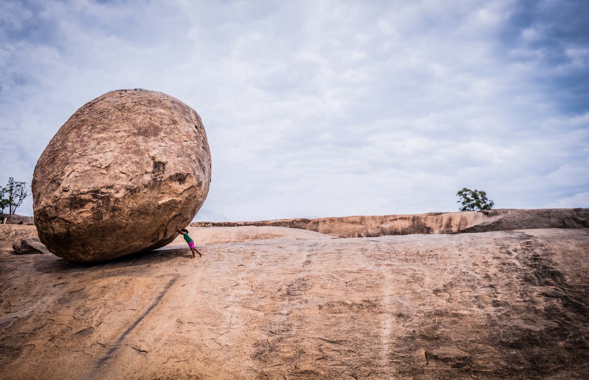 Known as Krishnas butterball this large granite boulder is one of many monuments that can be visited in Mahabalipuram 