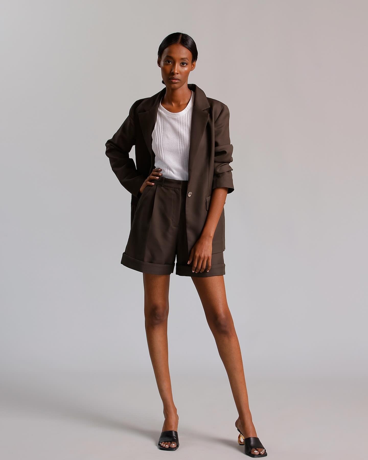 A new must have for the spring - a short suit set, especially in this espresso brown, oversized Isa suit jacket and Drew cuffed shorts.  #madeinchicago #sustainablefashion #springsuiting #timelessluxury #deadstockfabric #womenmade