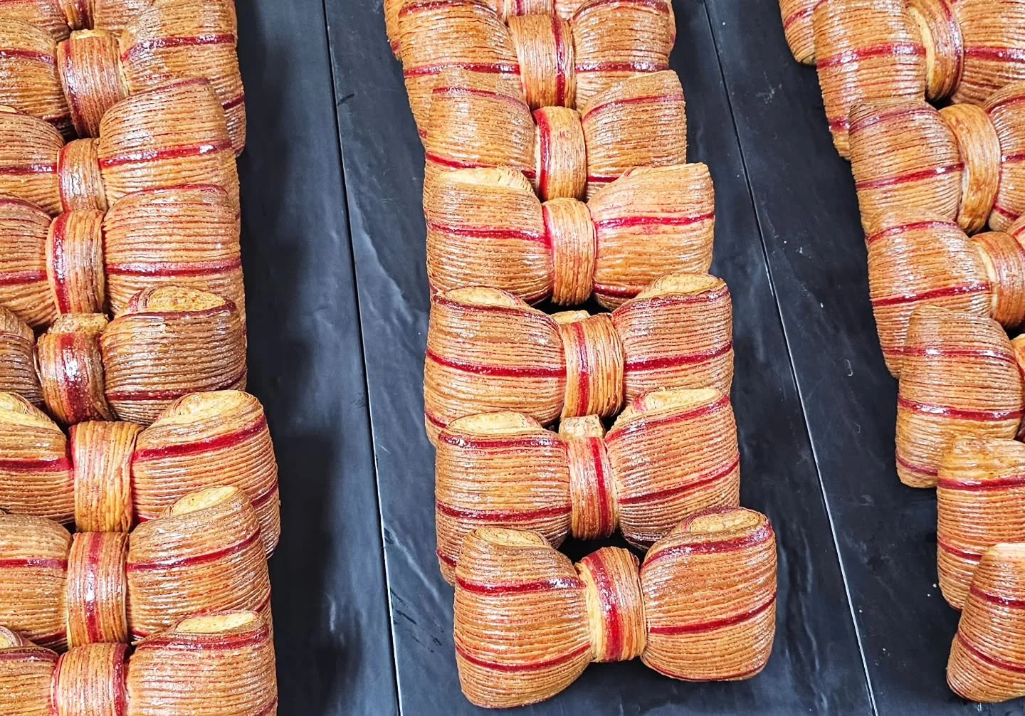 The strawberry/passion fruit bowtie pastry is all dressed up for the weekend. Come see these and  what other sweet treats we have in store for you!