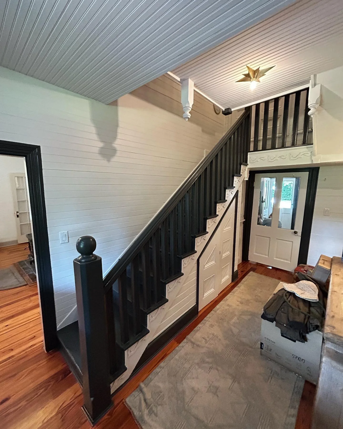 Clean, sand, clean, vacuum, and then we paint on this 1880 farmhouse in Brentwood. We painted the tongue and groove ceiling and doors in @farrowandball color "Soft White" and the railings, stair treads and trim in FB color "Railings.&q