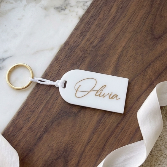 Rectangular acrylic name tag with ribbon attachment for event favours