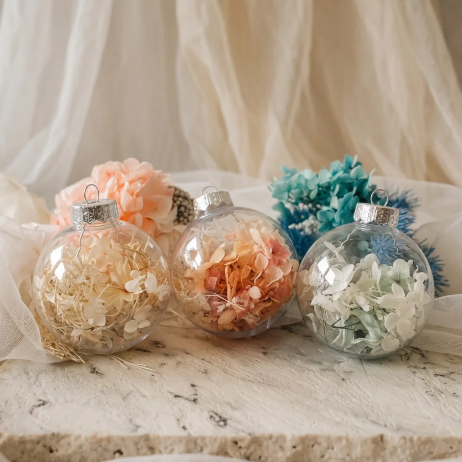 Preserved floral Christmas baubles showing different flower and colour combinations.
