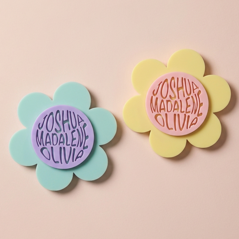 Glossy flower-shaped acrylic magnets in a choice of colours