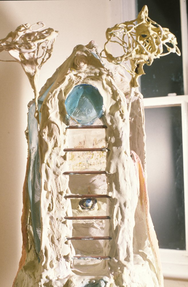   Chapel  (detail)  Wire, steel stand, bottom of glass bottle, fabric in plaster, copper rods, doll’s eye     