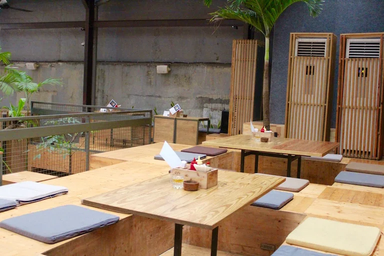 Kids and families will love the casual open space and cool elevated wooden seating that requires you to step up onto it.