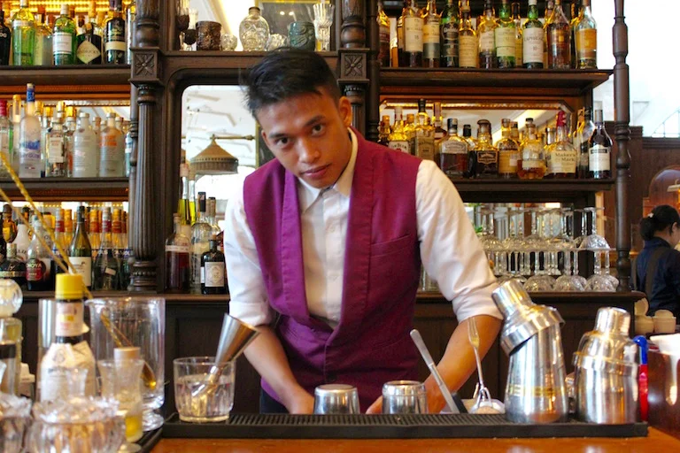 Barman Didi at the Gunawarman, working on a handcrafted signature cocktail