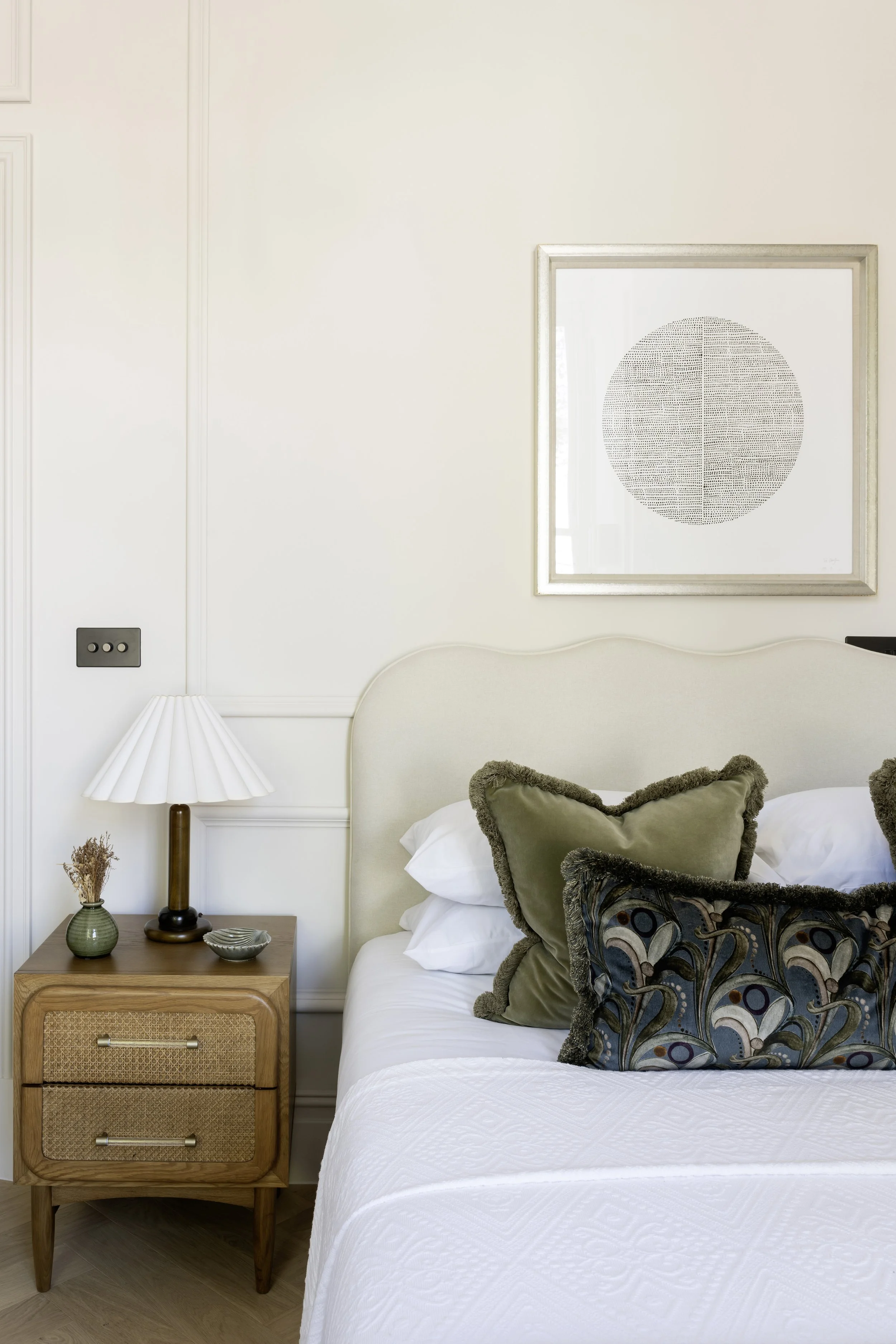 Bedroom home staging with layered green cushions at Somerset Road, Ealing.