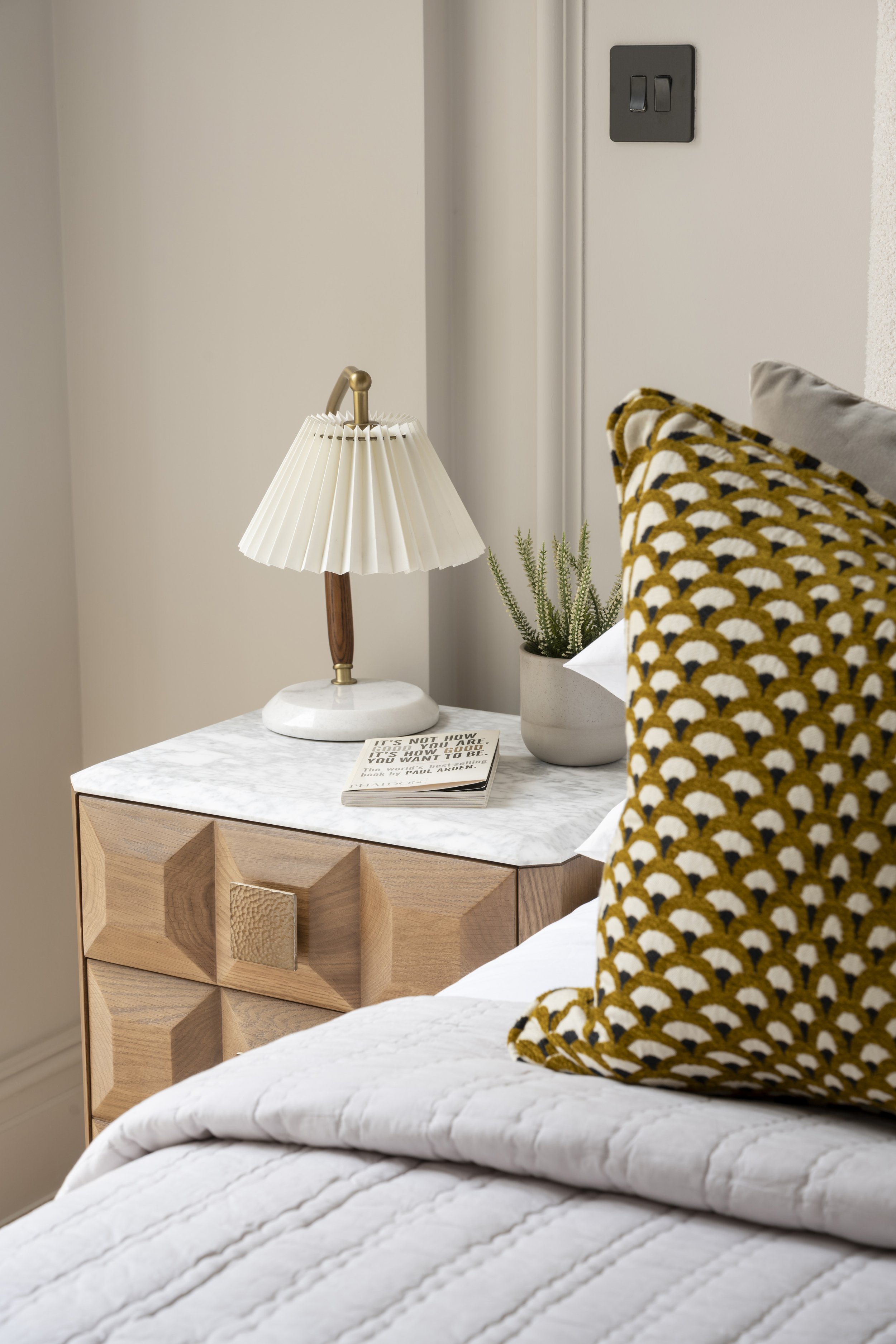 Bedroom styling detail with bedside furniture, lighting and accessories at Somerset Road, Ealing by Decor No5.