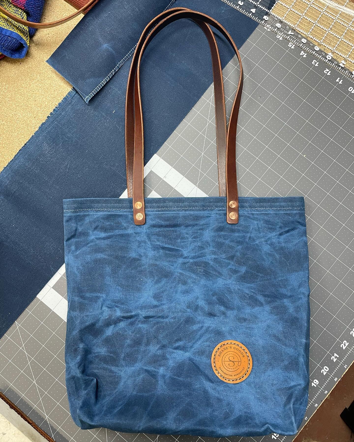 Shipping custom holiday orders this week. Here is a blue waxed canvas tote about to go out the door.