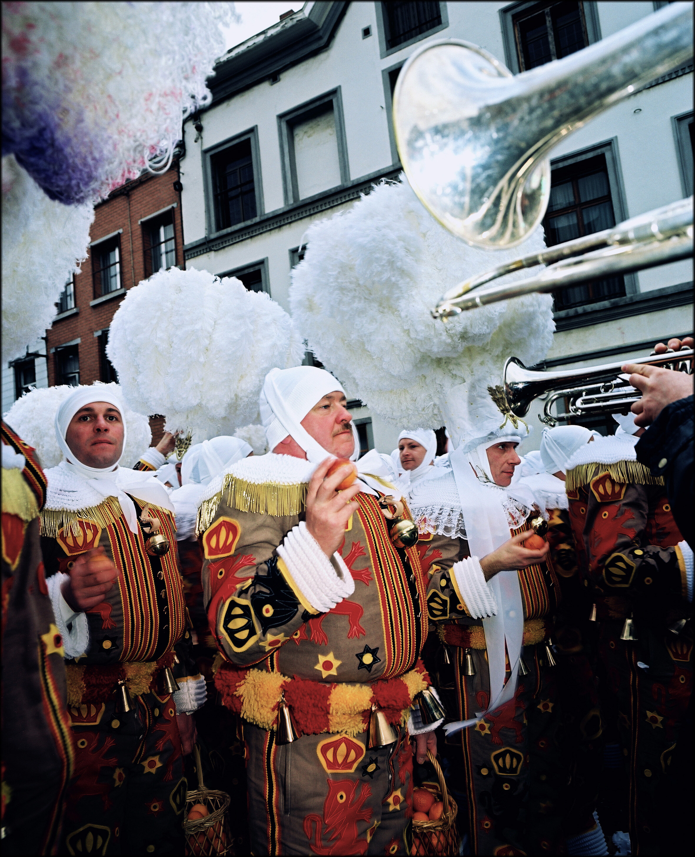  During the Shrove Tuesday’s afternoon procession in the city of Binche, the Gille wears his ostrich feathers hat and trows oranges 