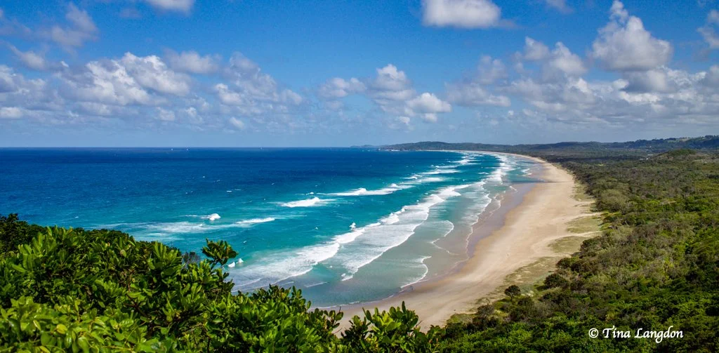 Turquoise ocean waves rolling on to the white sand of a New South Wales beach