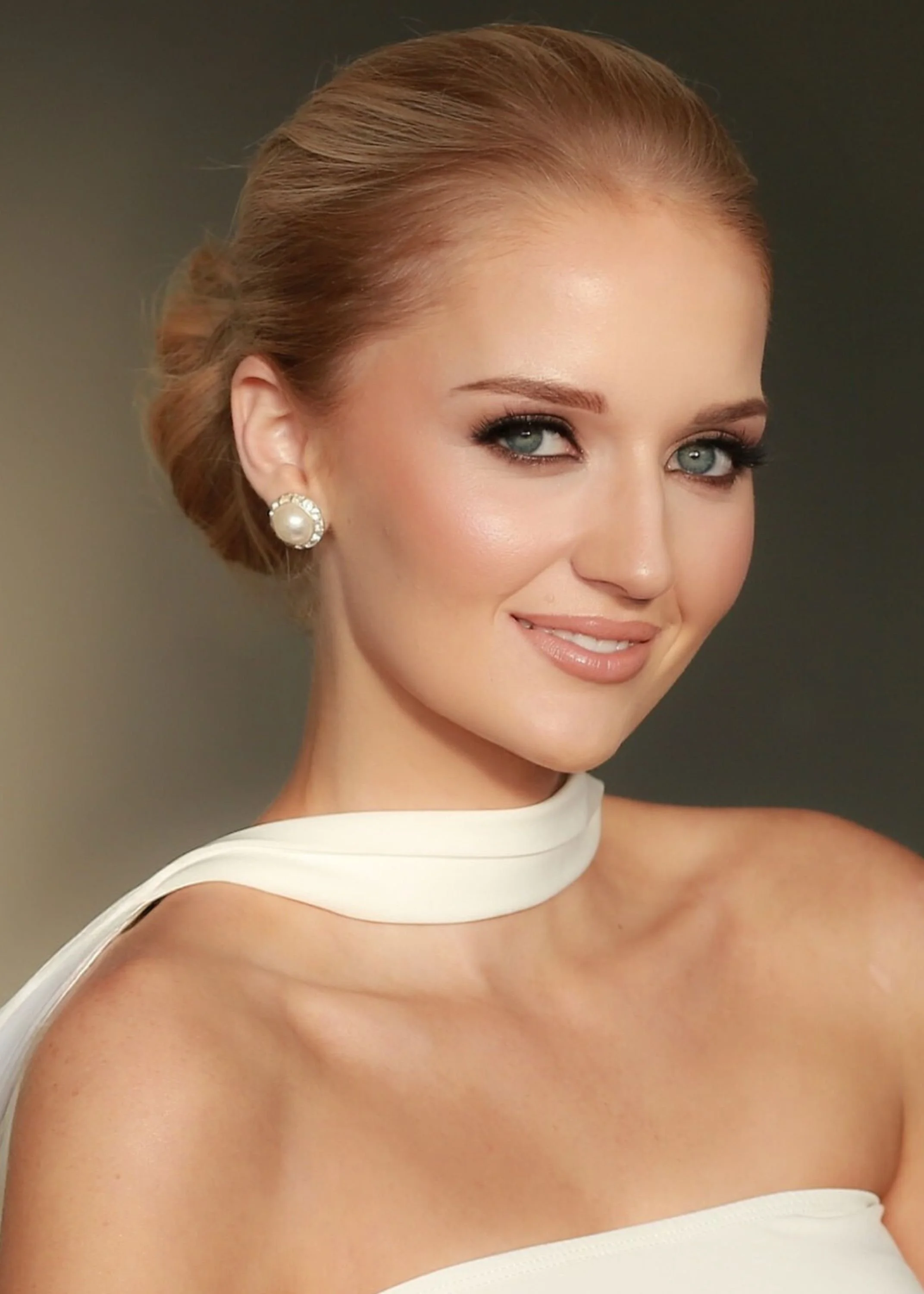 Smiling woman with long dark hair in a blue top