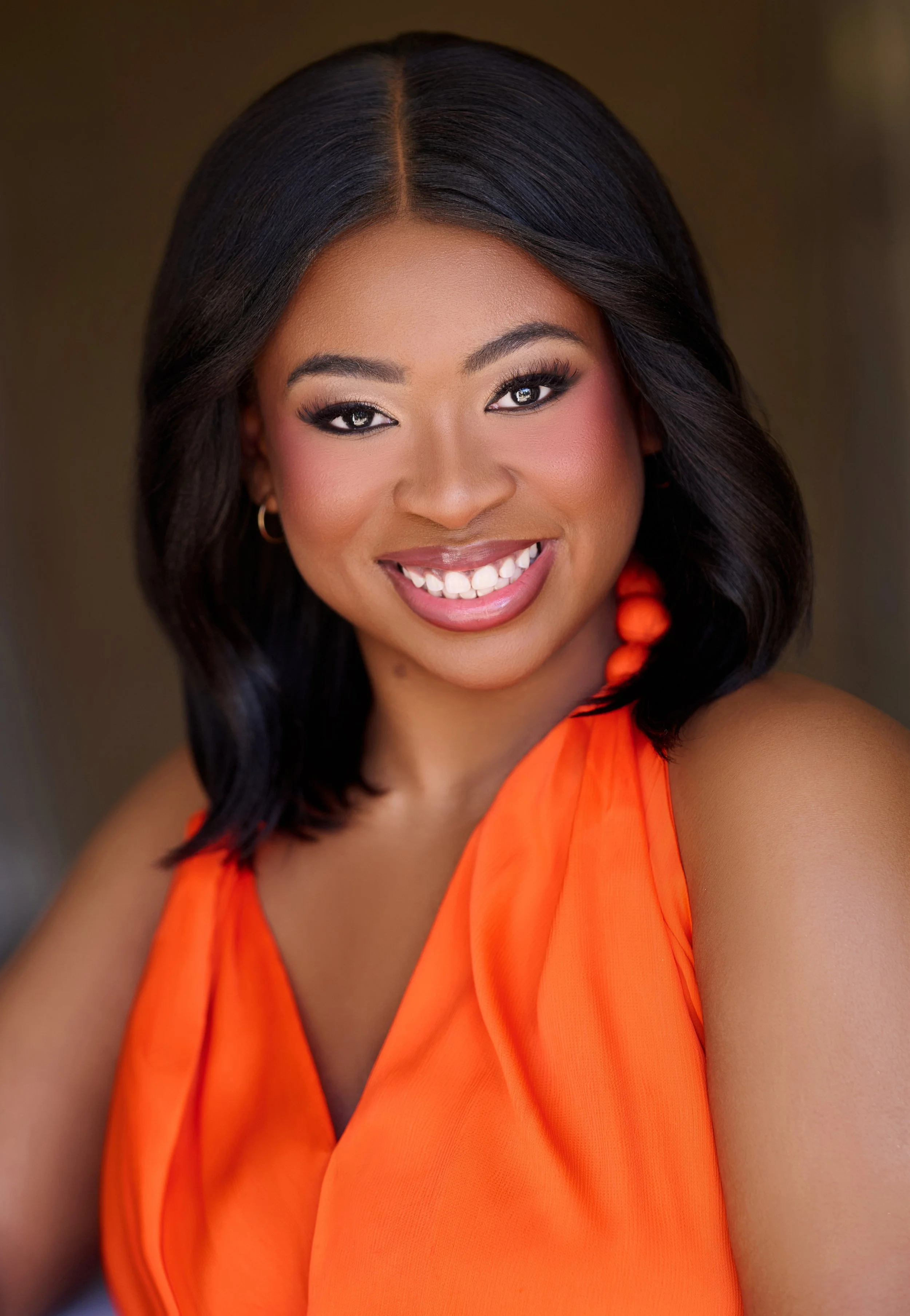 Smiling woman with long blonde hair in a blue top