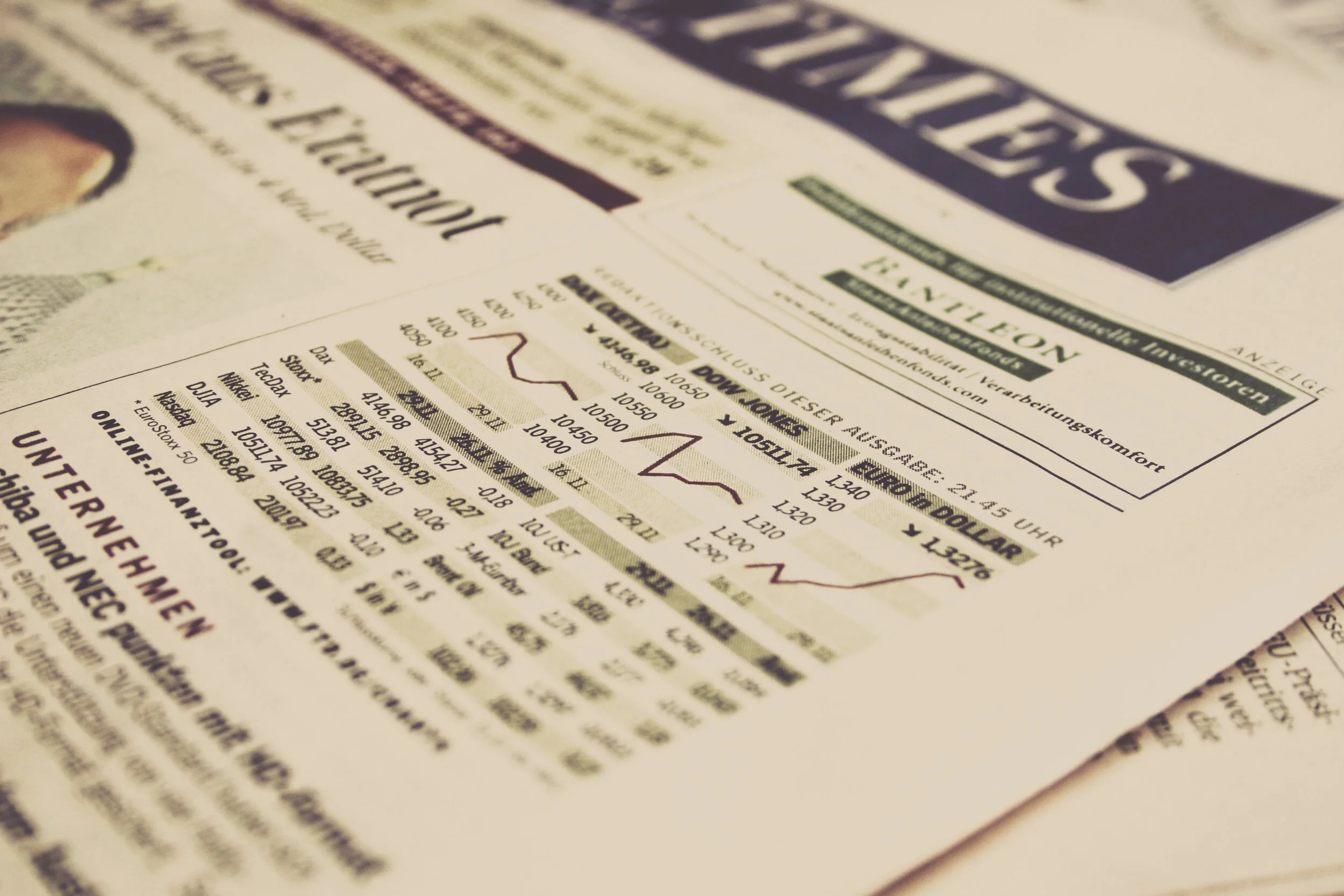 newspaper with economic graphs