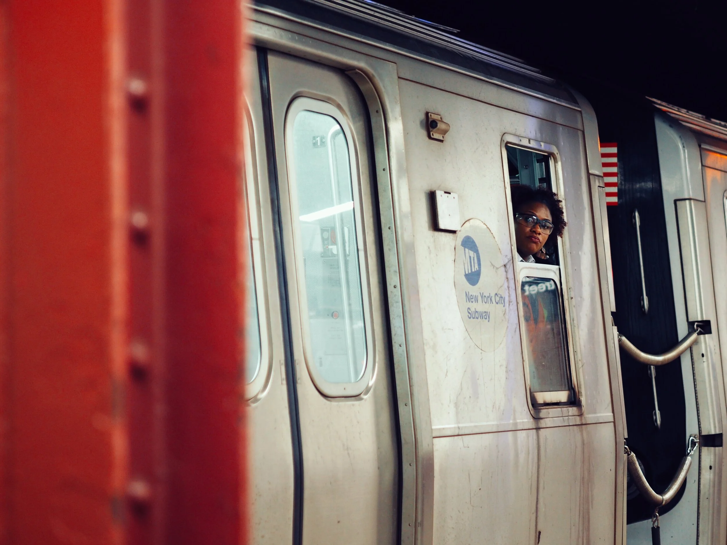 women looking out of train car window