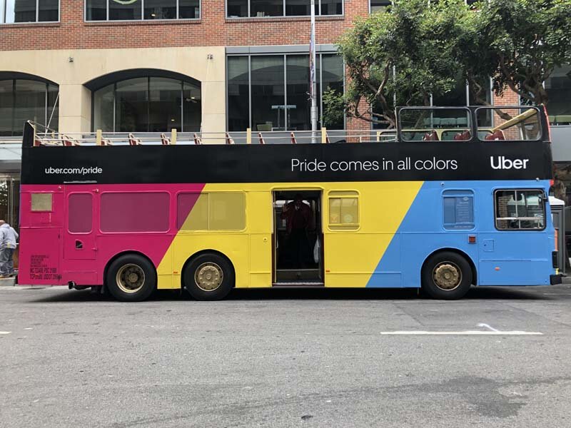 side view double decker bus pride colors