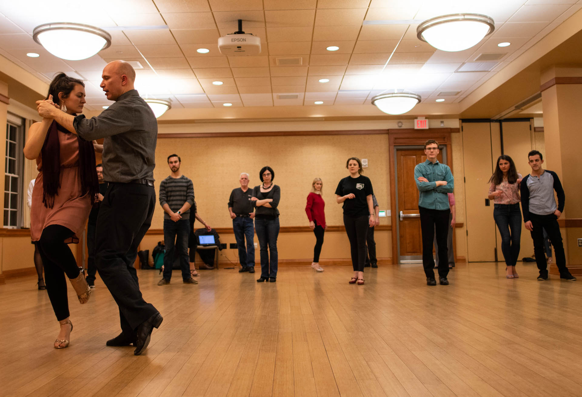  Maria Casa and Gabriel Prynn show their tango class the proper footwork for the next step of the dance on Thursday, February 14, 2019. Casa and Prynn teach the Argentinean Tango class in Baker Center, located in Athens, Ohio, every Thursday night at