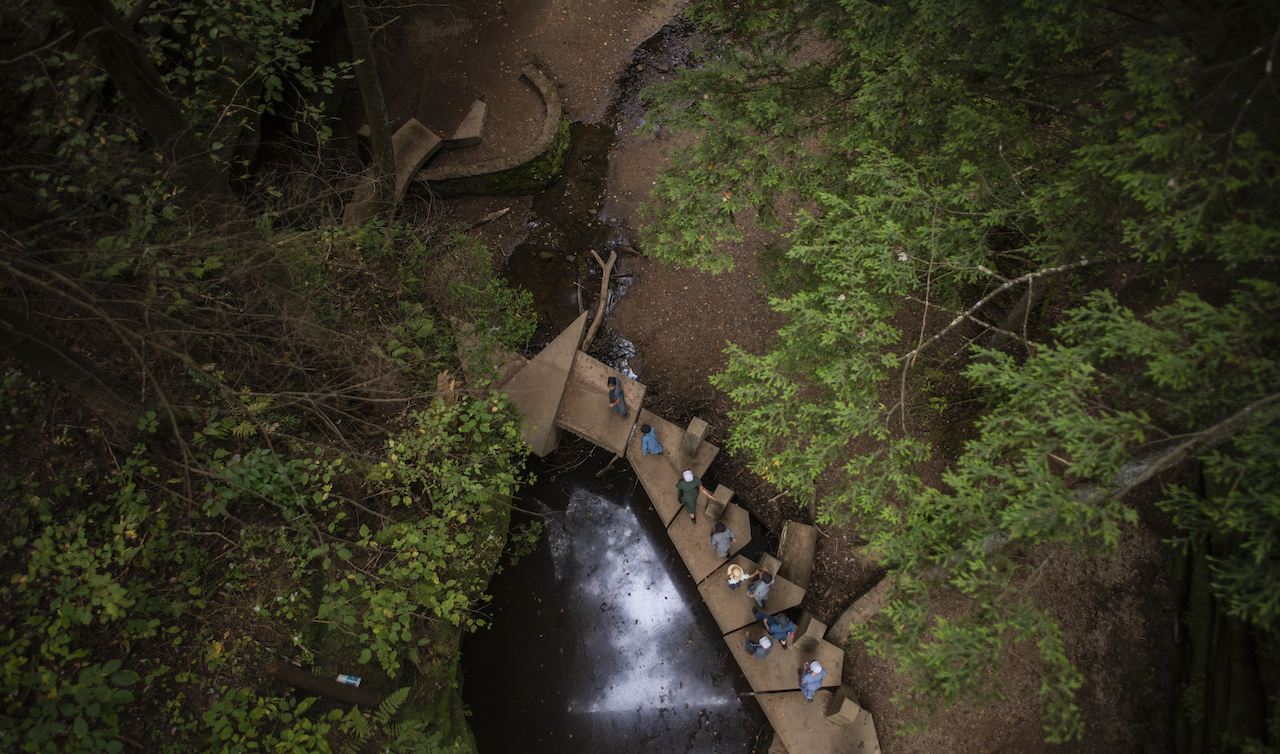  A group of Mennonites pass over a bridge at Old Mans Cave in Hocking Hills, Ohio, on Saturday, September 21, 2019. This bridge is a part of the main trail leading from the visitors center all the way through the park.  