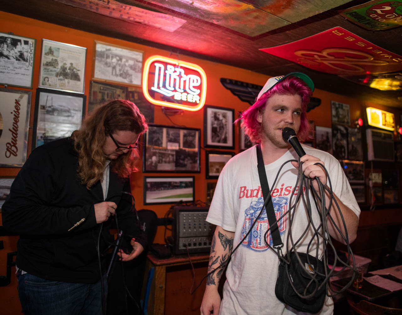  Frick (Right) and Tompkins (left) try testing the microphone before the Gorilla Party set at The Smiling Skull 