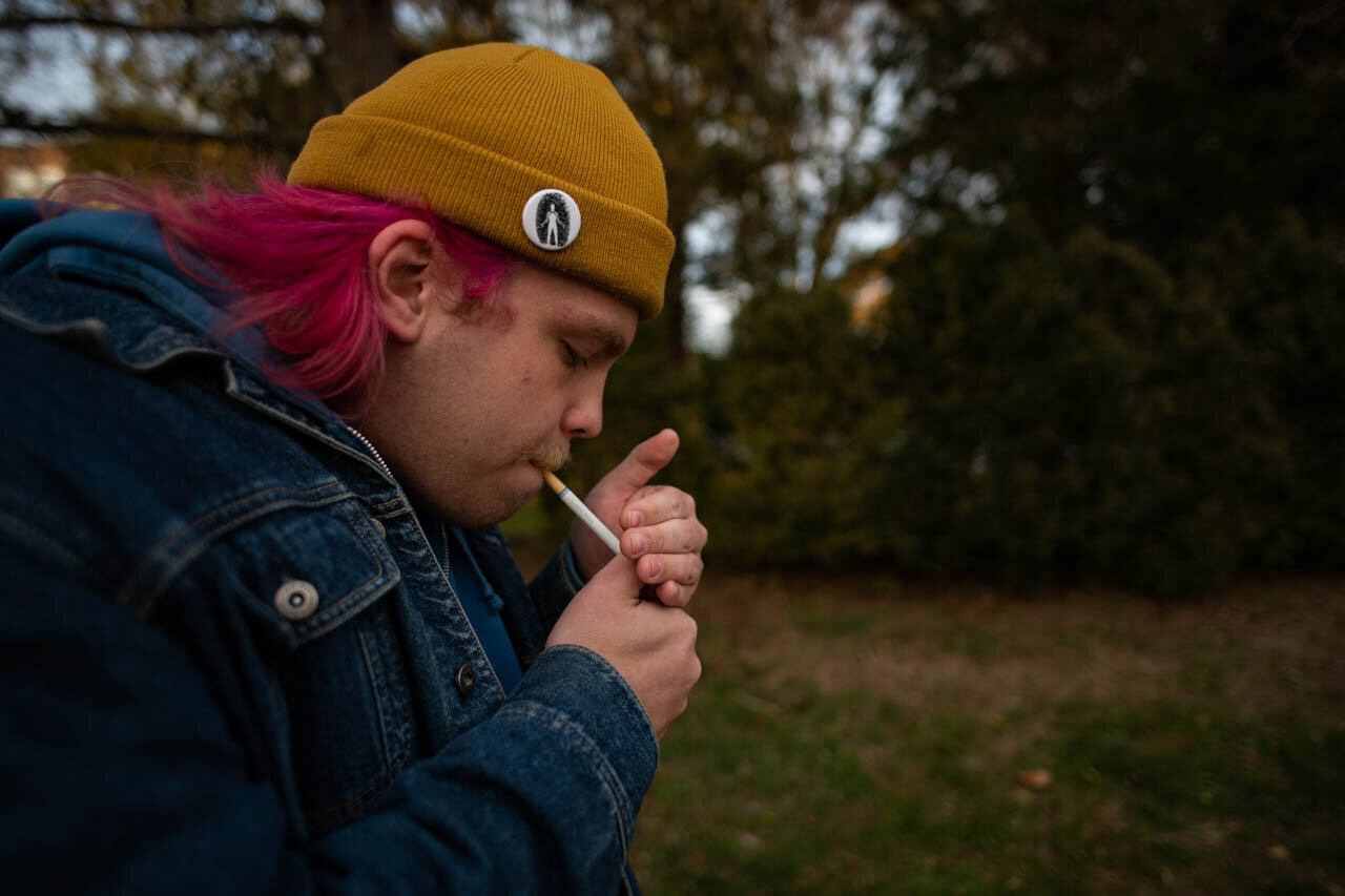  Tompkins lights a cigarette on his way to Nelson Market to meet with Gorilla Party member Preston Frick on Thursday, November 14, 2019.  