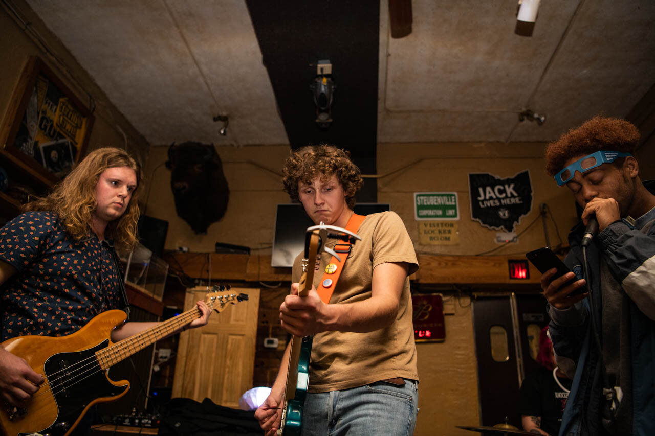  Frick (left), Dunlap (middle) and Jeremiah Hayes (left) perform a Post Malone cover song on Thursday, November 14, 2019. Dunlap lost most of his voice before the show and had local artists help play songs for the band during the show that he didn’t 