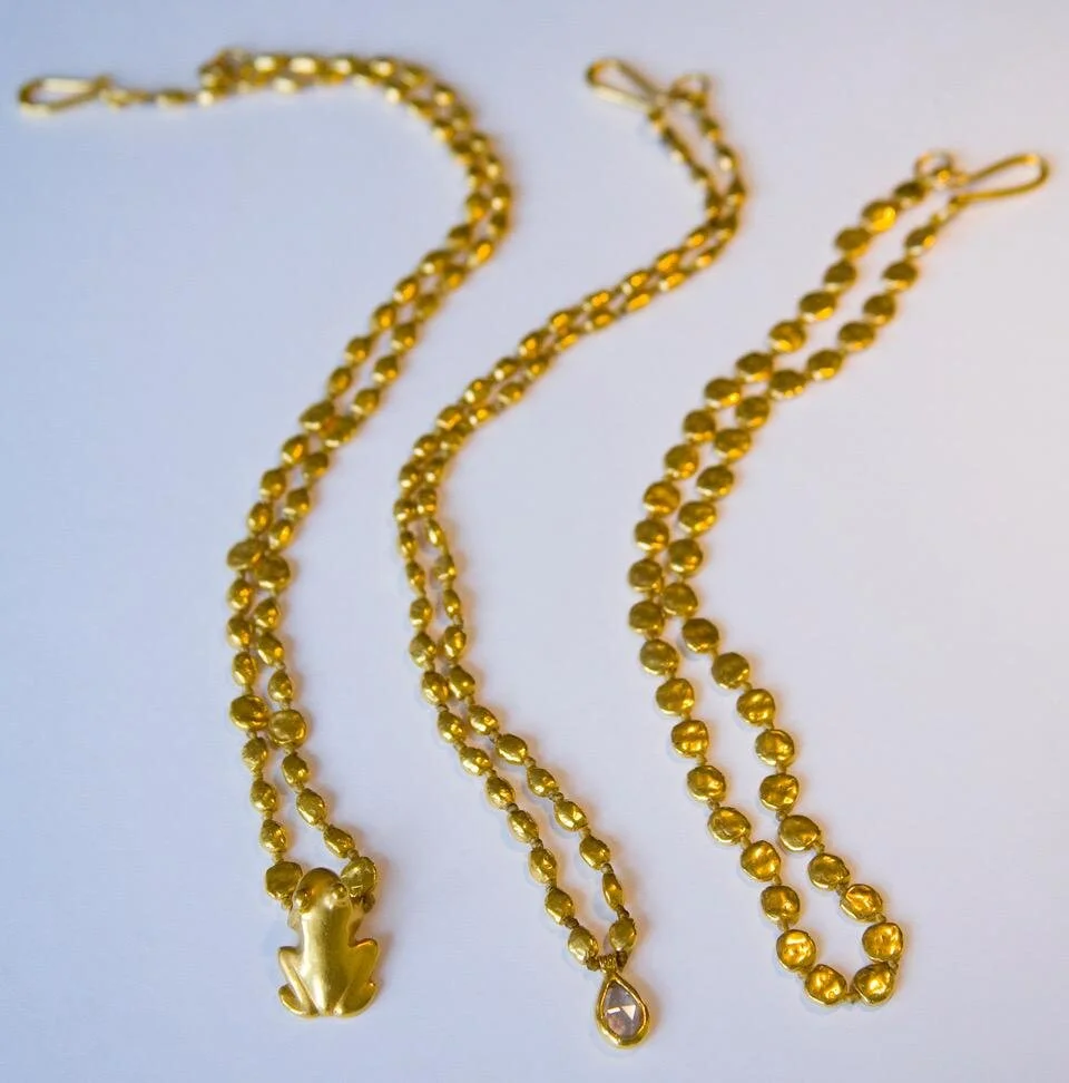 3 gold necklaces.jpeg