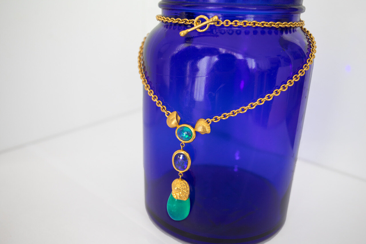 22k Gold handmade chain with gold seashells, black opals, and emerald drop
