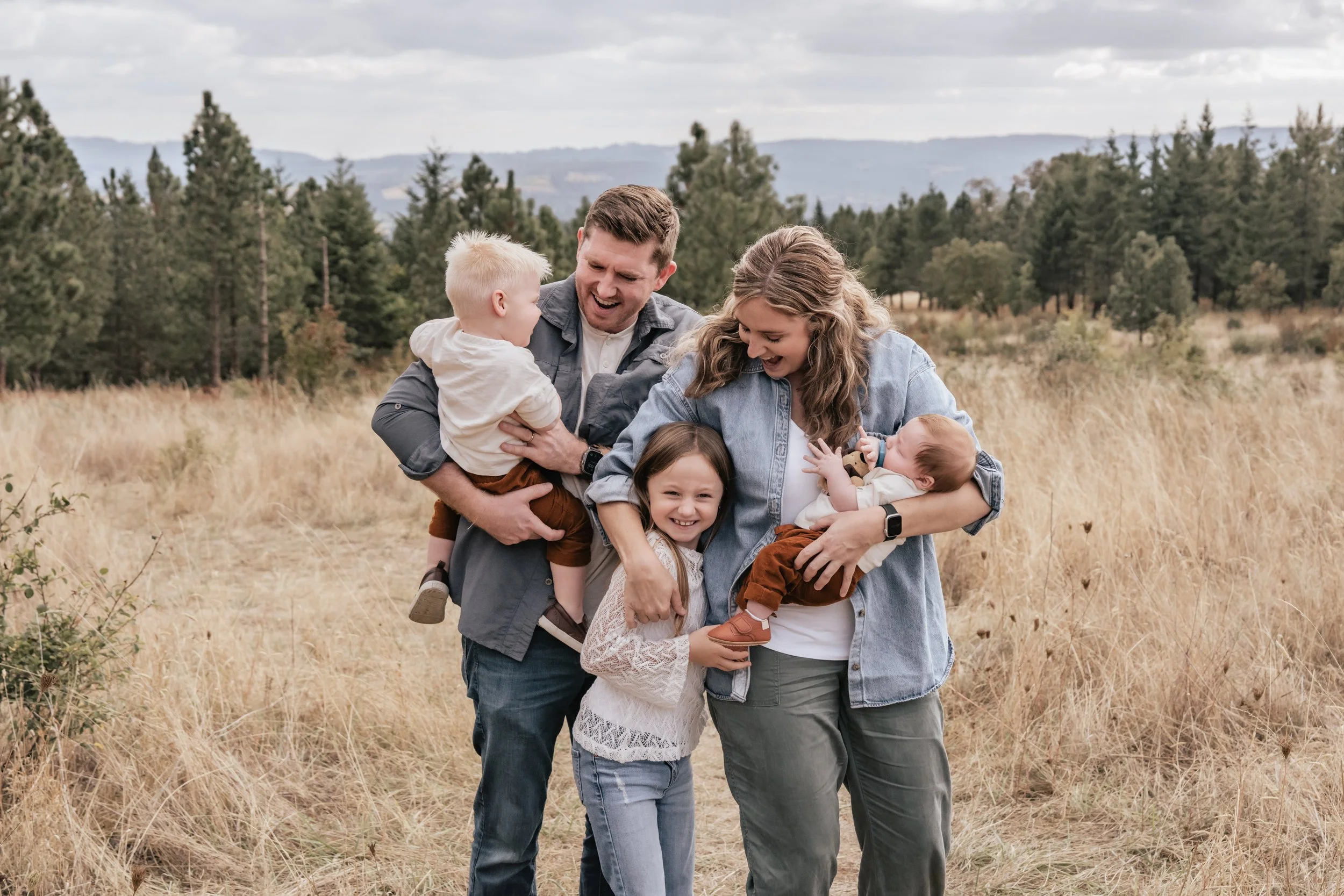 A family embraces in wine country.