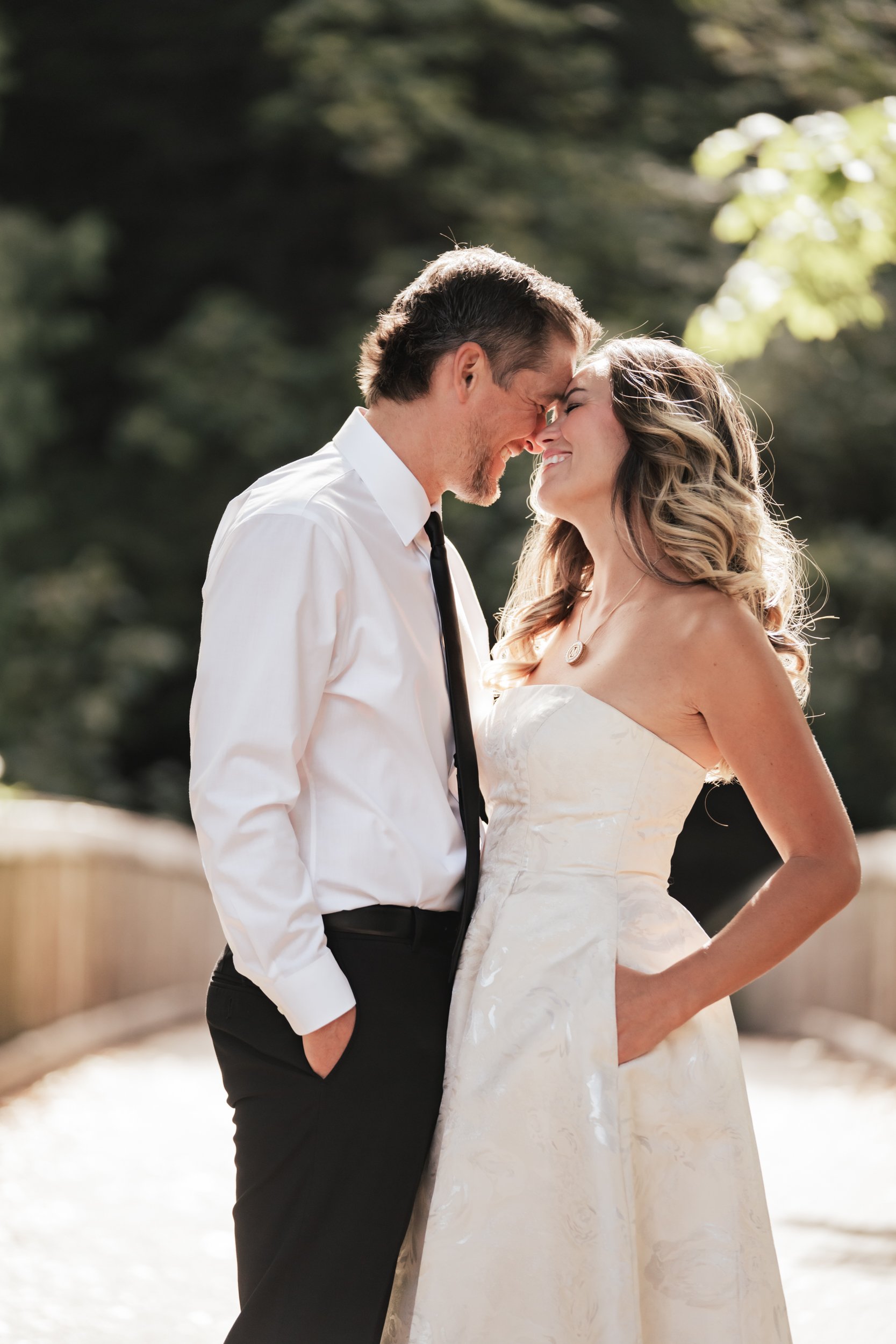 A well lit couple go in for a kiss.