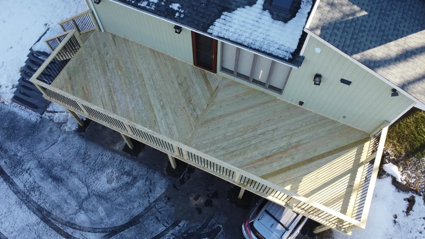 Pressure treated decking, railings, and frame. Decking ran as two 45 sections meeting in the middle with a breaker board. All edge screwed except the cut ends counter sinked with edge screws. Balusters powder coated metal rectangle. Frame, beam, and 