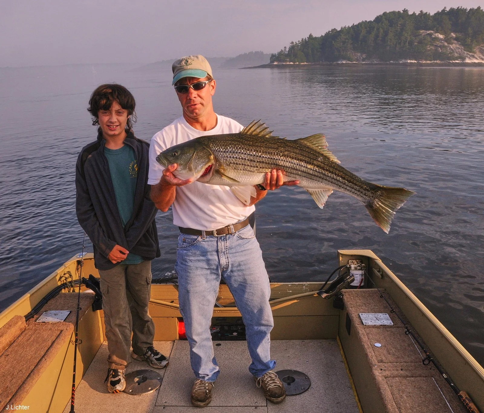 Striper fishing on lower Kennebec River.  Jon Nowinski and Evan Lichter.  Arrowsic, Maine.