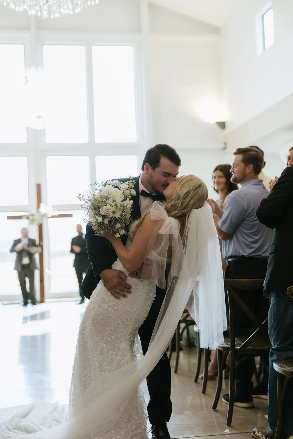 Bride and groom kissing at the altar at their wedding in South Dakota