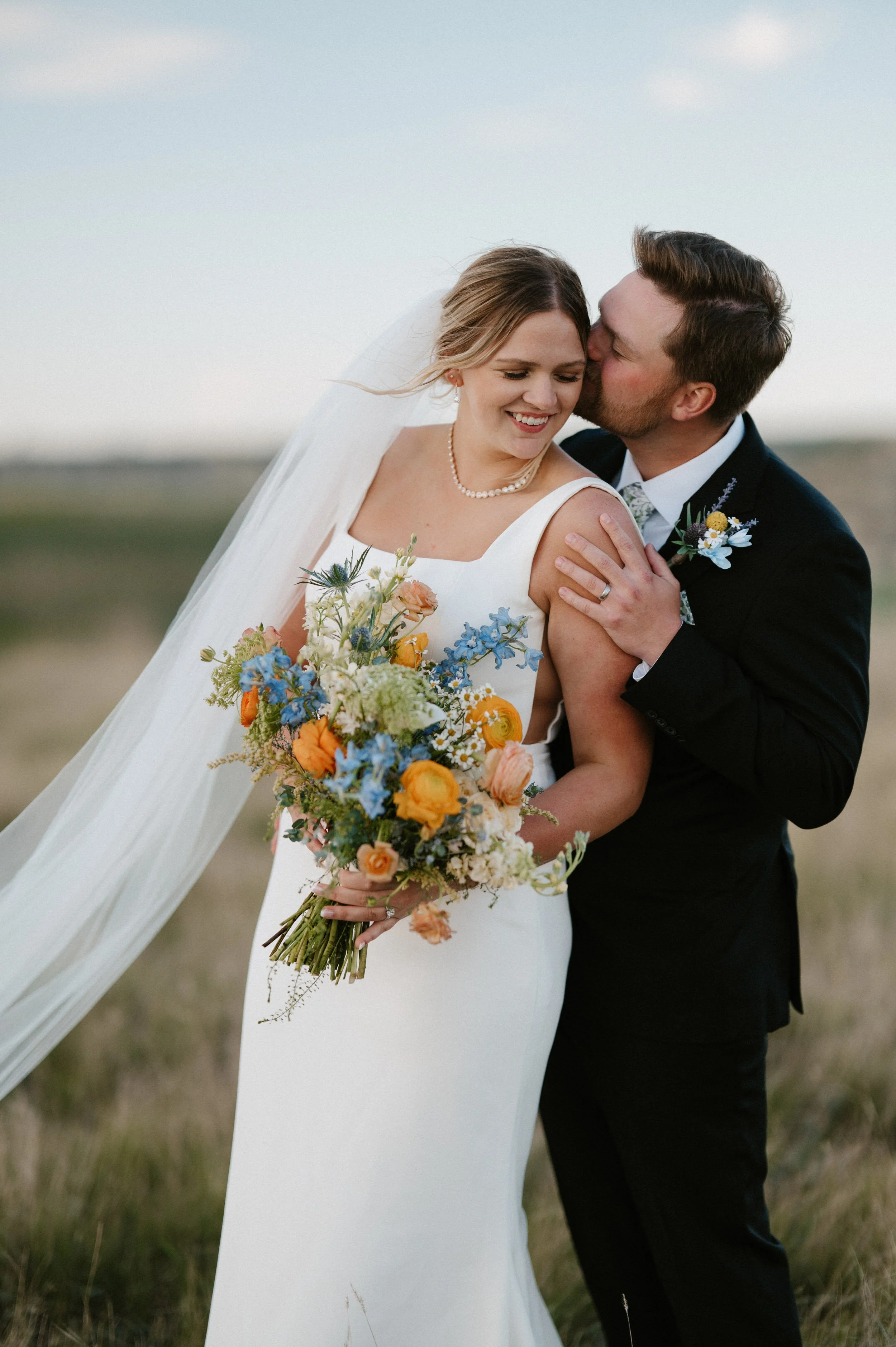 Bridal bouquet at Bride and groom at their Medora wedding planned by behind the scenes events.jpg