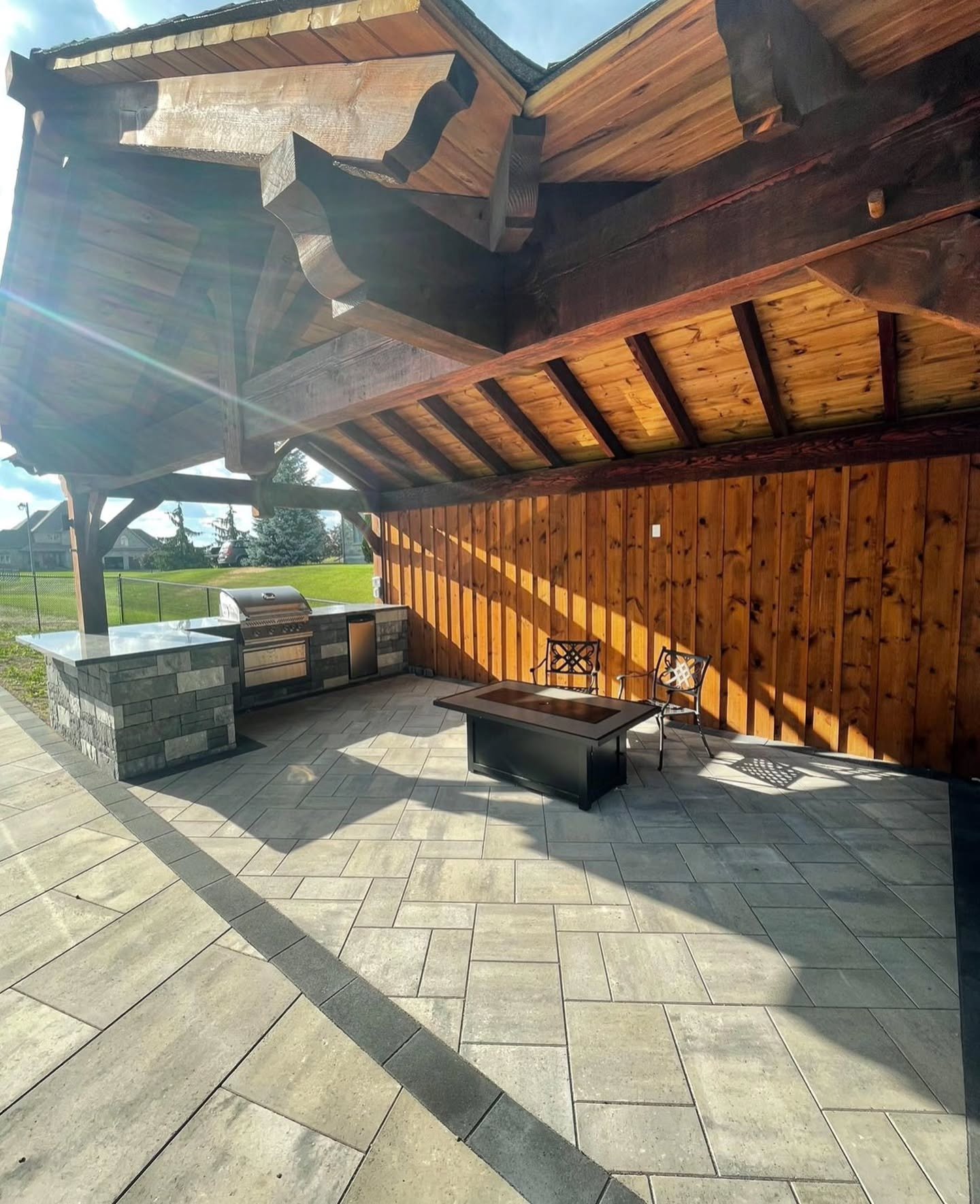 Backyard goals, brought to life 🌿🔥 This stunning outdoor space features a custom built-in grill island, a gorgeous timber structure, and endless room to relax and entertain &mdash; all crafted to perfection by Halton Landscape.

Ready to transform 