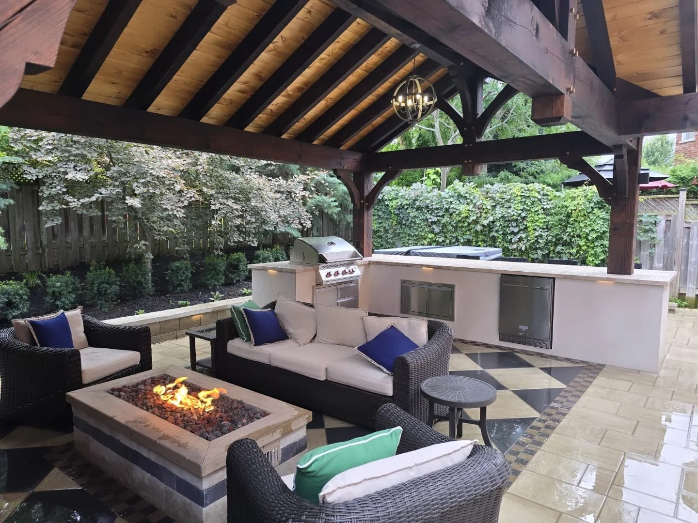 Rain or shine 🌧️➡️☀️ this project was built to impress!

Featuring a porcelain-veneered outdoor BBQ grill, a stunning timber structure, and a custom firepit with a Warming Trends brass burner 🔥 &mdash; all beautifully finished with Techo-Bloc paver