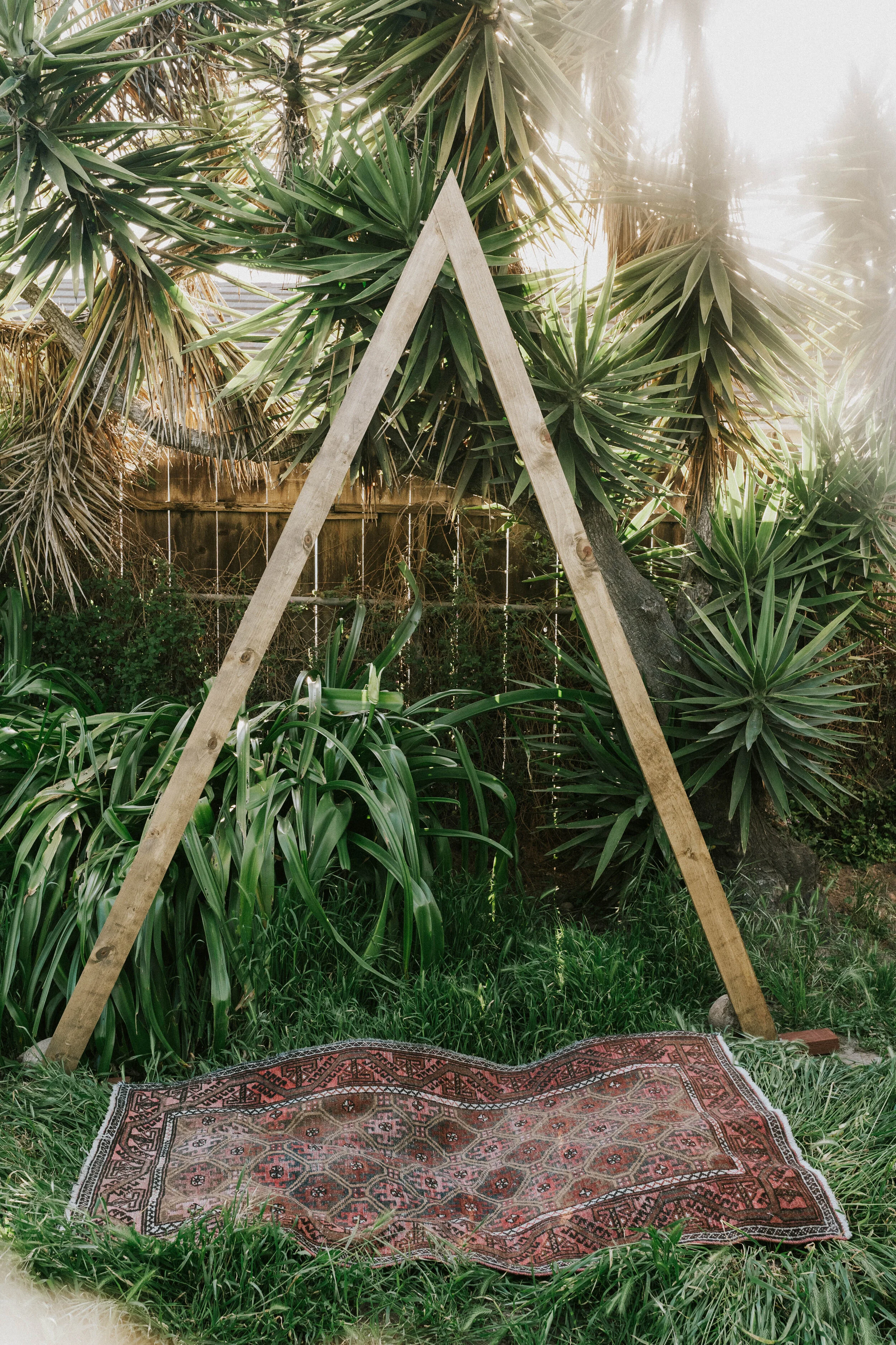 Best boho wedding ideas wooden Triangle arch tropical backyard-wedding-elopement-ideas-ceremony-details-and-ideas-ali-brian-photos-lauren-turner-photography-adventure-elopement-intimate-wedding-photography-san-diego-southern-california-07564.jpg