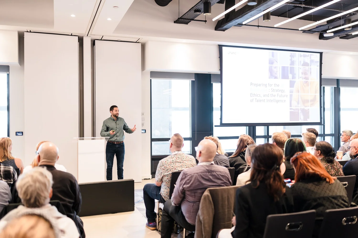 A speaker sharing practical insight with a People Strategy Hub audience