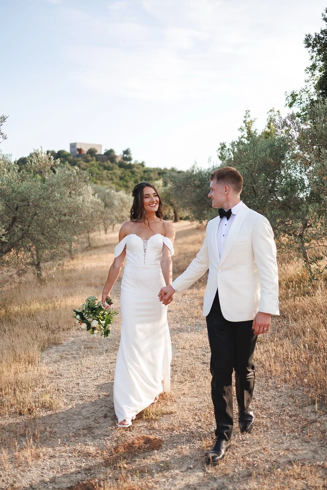 Oliver & Nikkita Vass - Oliver wears white tuxedo jacket and black dinner trousers, with dress shirt also made by Roberto Revilla London